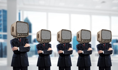 Businessmen with old TV instead of head.