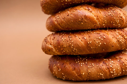 Fresh begel on the brown and white background