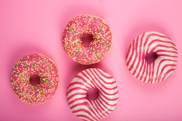 Donuts on a pink background.