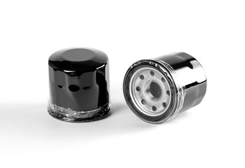 Two oil filters. Close up. Isolated on white background.