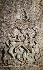 Stone carving Apsara in Bayon temple at Angkor Thom
