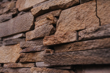 Old stone texture. Pattern brown and gray colors of style design decorative cracked stone wall surface.