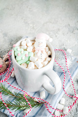 Creative idea for christmas drink, delicious hot chocolate with funny marshmallow snowman, christmas tree, rain dear, santa, on home background with xmas decoration copy space top view