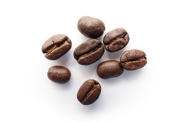 Roasted coffee beans isolated on white background.