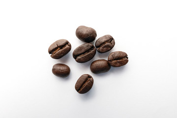 Roasted coffee beans isolated on white background.