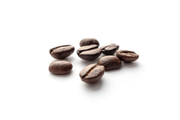 Roasted coffee beans isolated on white background.