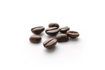Roasted coffee beans isolated on white background.