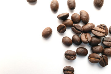 Roasted coffee beans isolated on white background.