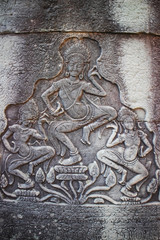 Stone carving Apsara in Bayon temple at Angkor Thom