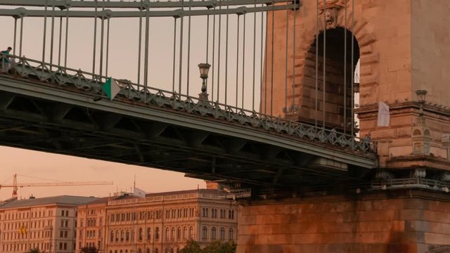Beautiful cinematic shot of the Chain Bridge in Budapest, Hungary during sunset. Built by the Scottish engineer Adam Clark