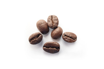 Roasted coffee beans isolated on white background.