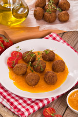 Meatballs with mashed carrots. 