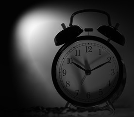 alarm clock on black background