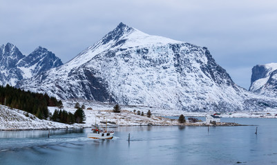 Fototapeta na wymiar Lofoten islands, Norway. Winter landscape, snowy mountains in the background. Travel Norway.