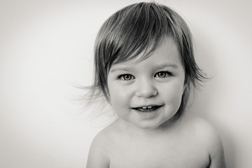 Little girl smiling isolated, black and white
