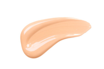 Smear of foundation. Beautiful advertising glance photo. Cosmetics concept isolated on white