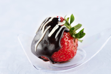 chocolate covered strawberries on white background closeup