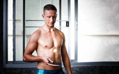 Fototapeta na wymiar A portrait of a young man, healthy gym and workout concept .