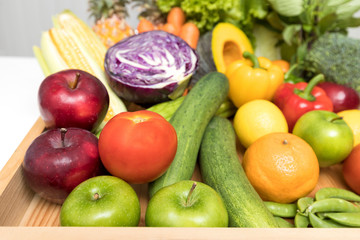 Close up of assorted fruits, vegetables and herb.