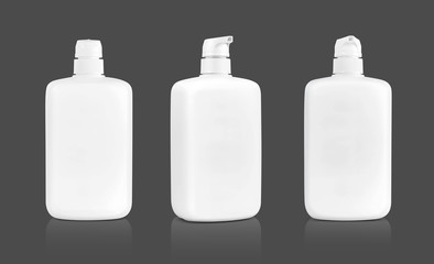 white cosmetic cream pumping bottle isolated on gray background