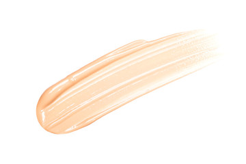 Smear of foundation. Beautiful advertising glance photo. Cosmetics concept isolated on white