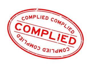 Grunge red complied word oval rubber seal stamp on white background