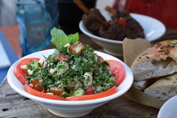Traditional Lebanese Tabbouleh salad with tomatoes, parsley, lemon, mint