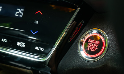 Engine start button with air control panal on Luxury caris a new technology used instead of starting the engine with keys in Transportation and safety concept.