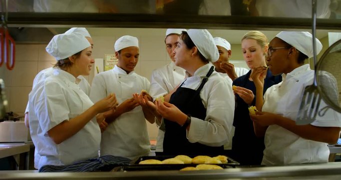 Chefs testing cookie in kitchen 4k