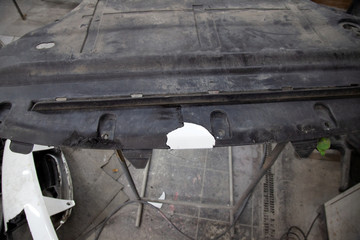 Repair of plastic car body trim by gluing and soldering a broken piece during an accident in a...