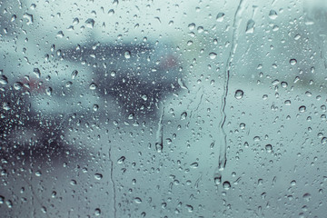drop water rainy on the glass window car, the reflection background water on glass