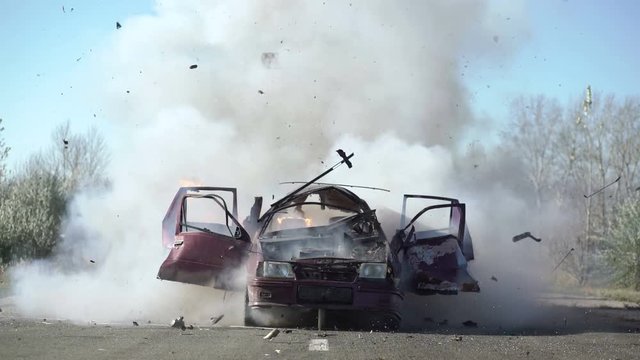 Car Explosion On The Road. Car burning.
