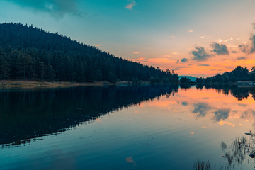 Sunset on the lake, image with orange and teal tone