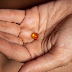 The girl applies Vitamin A and E