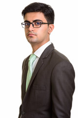 Portrait of young handsome Persian businessman wearing eyeglasses