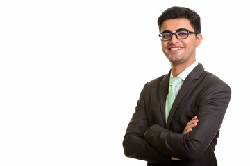 Young happy Persian businessman smiling with arms crossed