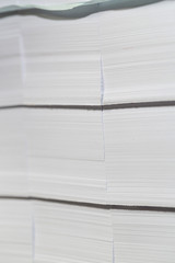 Close-up stacks of white paper. The pre-cut cards from thick paper.