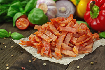 Meat, slices on a wooden table