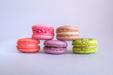 Cake macaron or macaroon on light background, colorful almond cookies, pastel colors