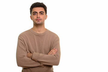 Fototapeta premium Young handsome Persian man with arms crossed