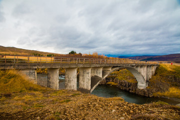 Fototapeta premium old stone bridge over the river