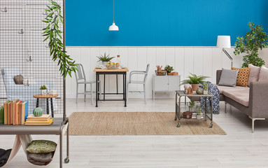 Decorative metal object in the living room and blue white wall.