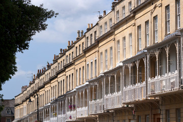 Fototapeta premium A row of ornate canopied balconies on terraced town houses in the Clifton area of Bristol, UK