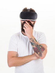 Man wearing virtual reality goggles in white background. Man using virtual reality headset. VR...