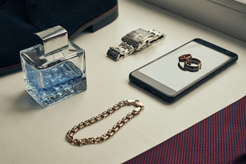 different accessories of a businessman for creating a style of a people lie on a wooden background