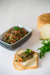 eggplant caviar with tomatoes and a slice of bread