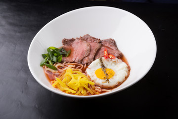 Asian ramen soup served with meat