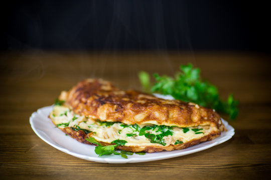 fried omelet with cauliflower and greens in a plate