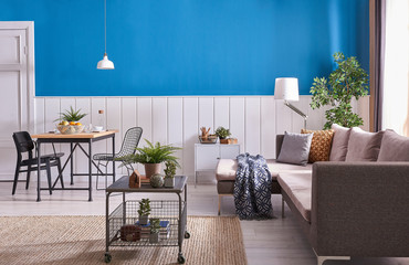 Modern home decoration blue and white wall with sofa.