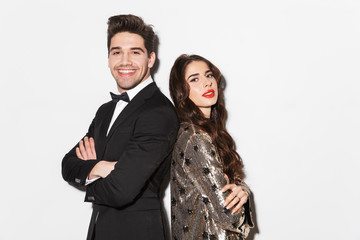 Cheerful young smartly dressed celebrating New Year